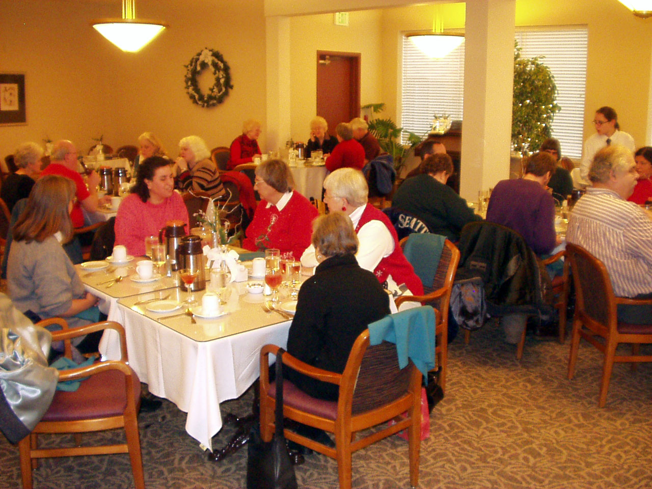 Taken from another angle behind Gloria and Shirley is a table with Denise, Berl, Anna, and Zandra and another table with Christine, Kathleen, Tonee and Howard.