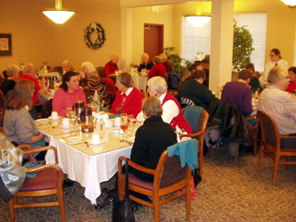 Taken from another angle behind Gloria and Shirley is a table with Denise, Berl, Anna, and Zandra and another table with Christine, Kathleen, Tonee and Howard.