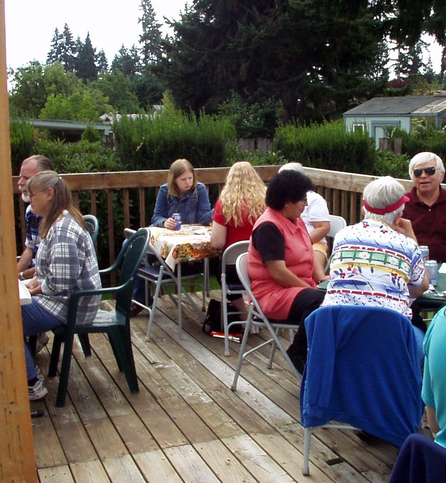 Here are some friends talking together and enjoying snacks before lunch is served.