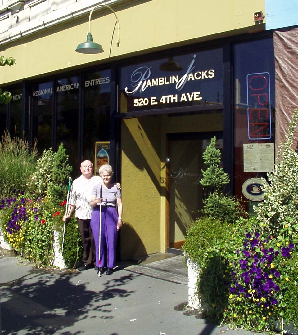 Two members in front of Ramblin Jacks entrance.
