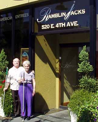 Two members in front of Ramblin Jacks entrance.