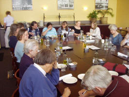 Photo #1 of members and guests sitting around tables