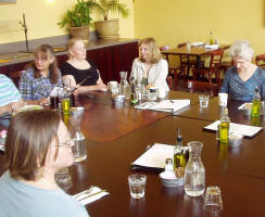 Photo #3 of members and guests sitting around tables